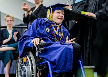 Accessibility SHU student in wheelchair at commencement.