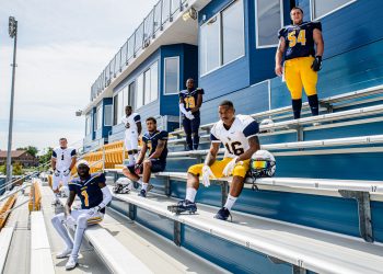 ZF-BO-FootballMediaShoot-08.30.2019-01 football players on bleachers